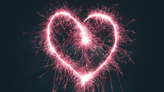 Pink heart created from sparklers